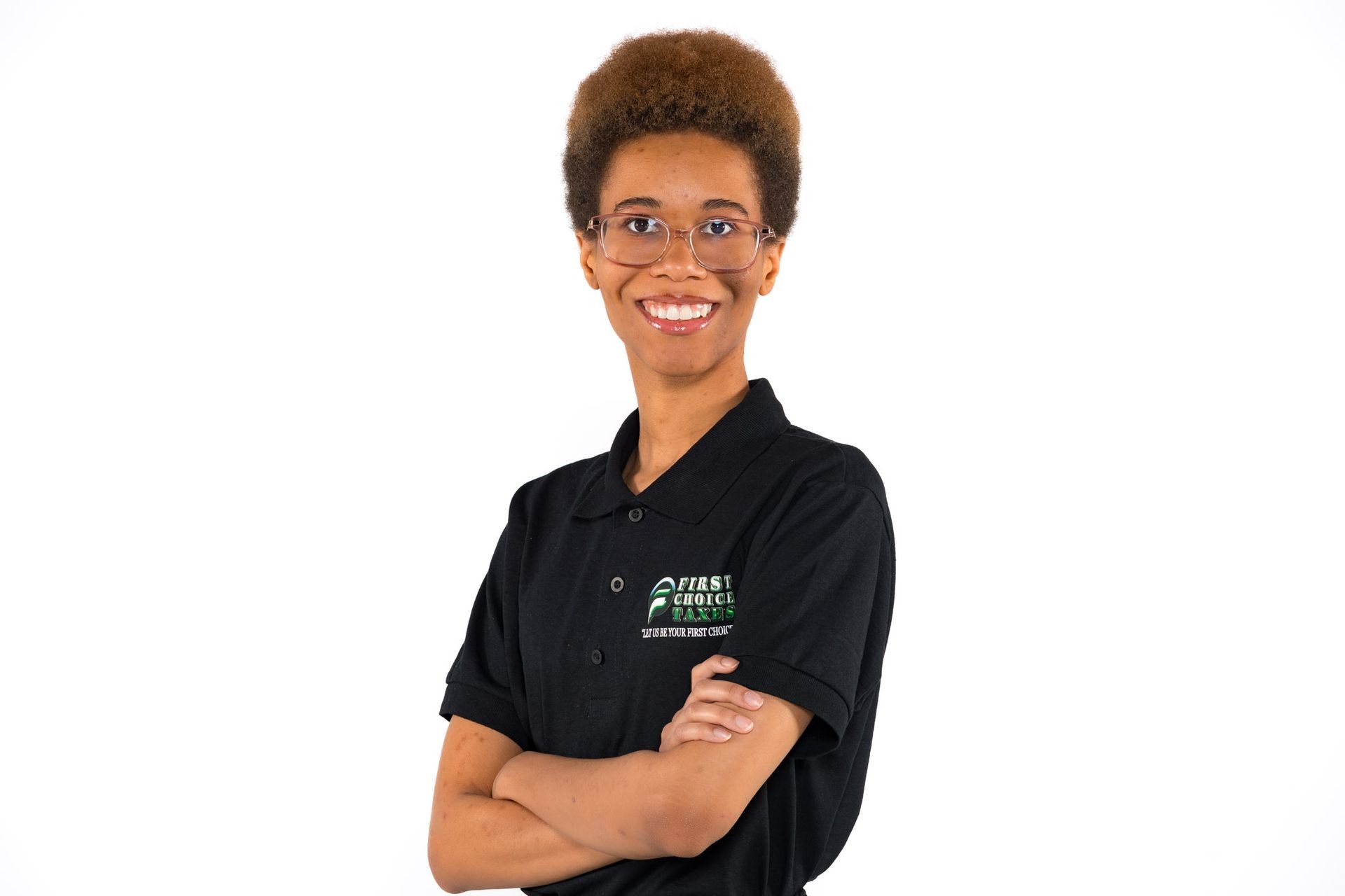 Person wearing a black polo shirt with folded arms, standing against a white background.