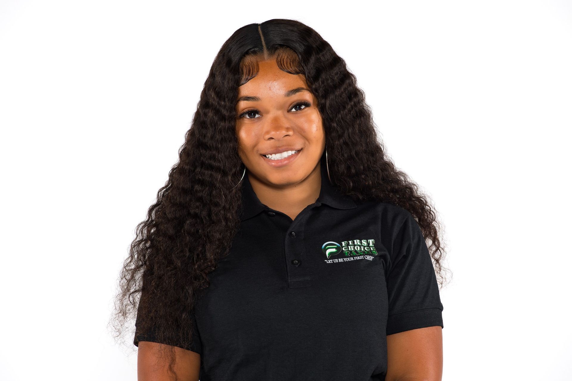 Person in a black polo shirt with 'First Choice' logo, smiling against a white background.