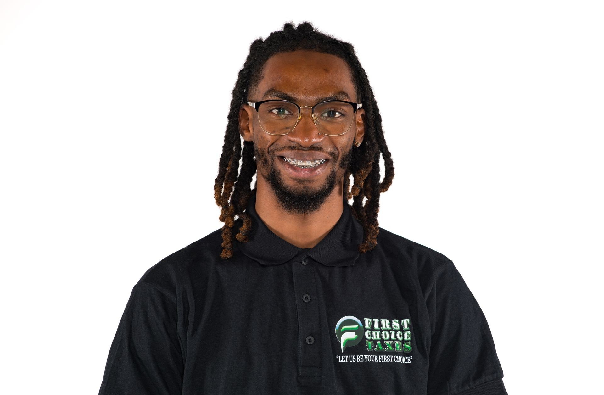 Smiling person wearing glasses and a black shirt with 'First Choice Taxes' logo.