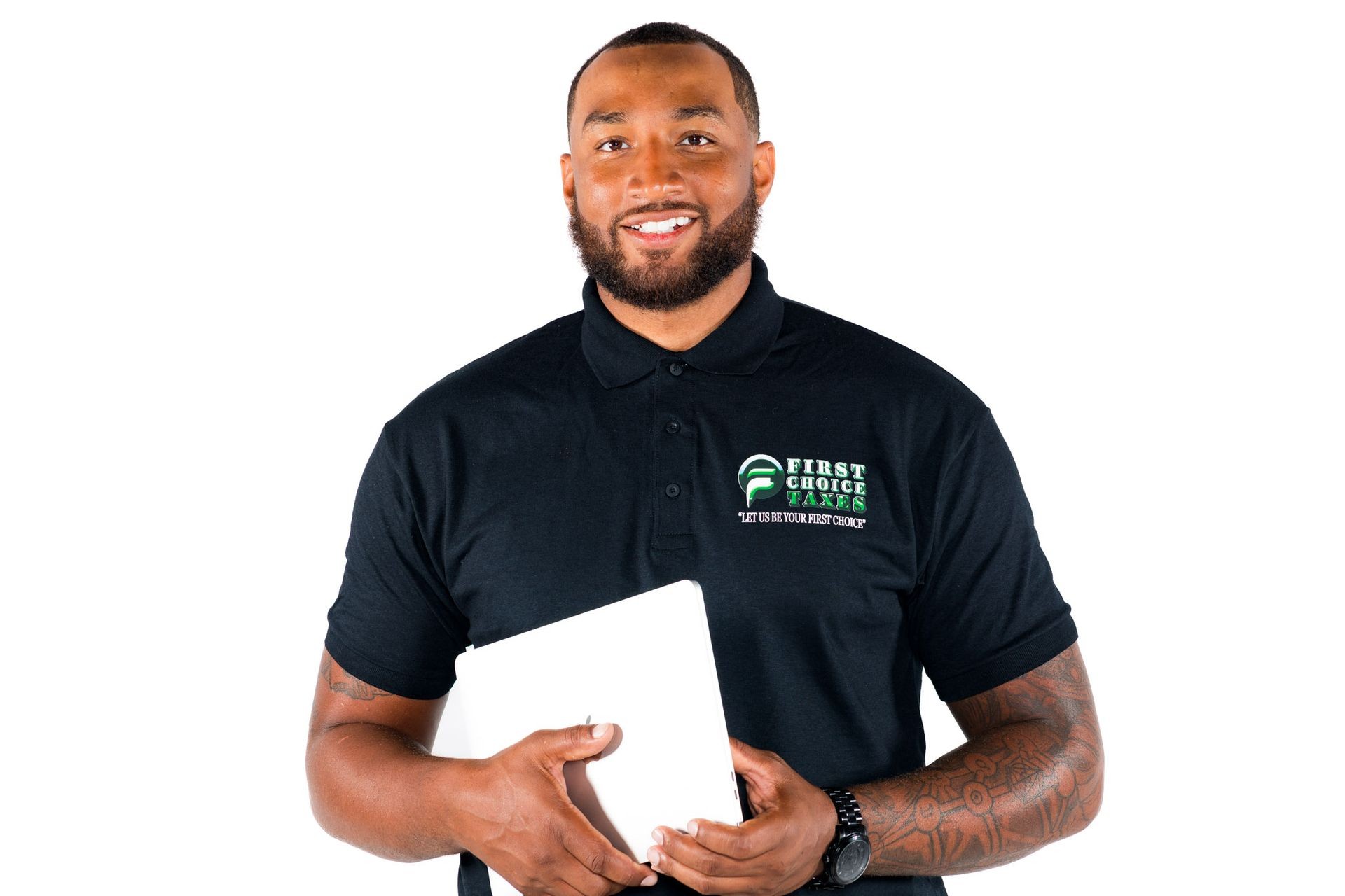 Smiling man in a branded polo shirt holding a tablet against a white background.